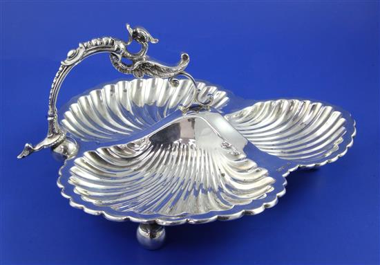 A late Victorian silver three division shell shaped hors doeuvres dish, 20 oz.